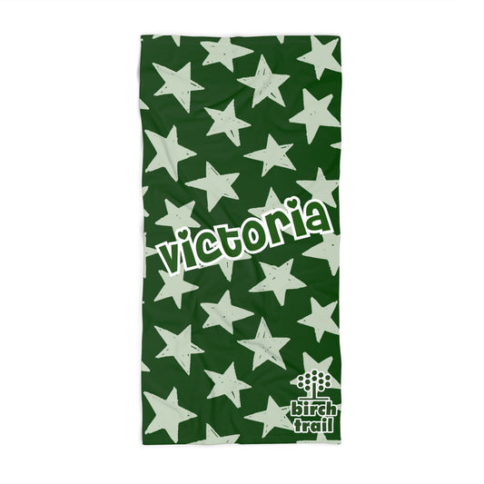 Green towel with white star pattern and 'Victoria' text, featuring Birch Trail logo.