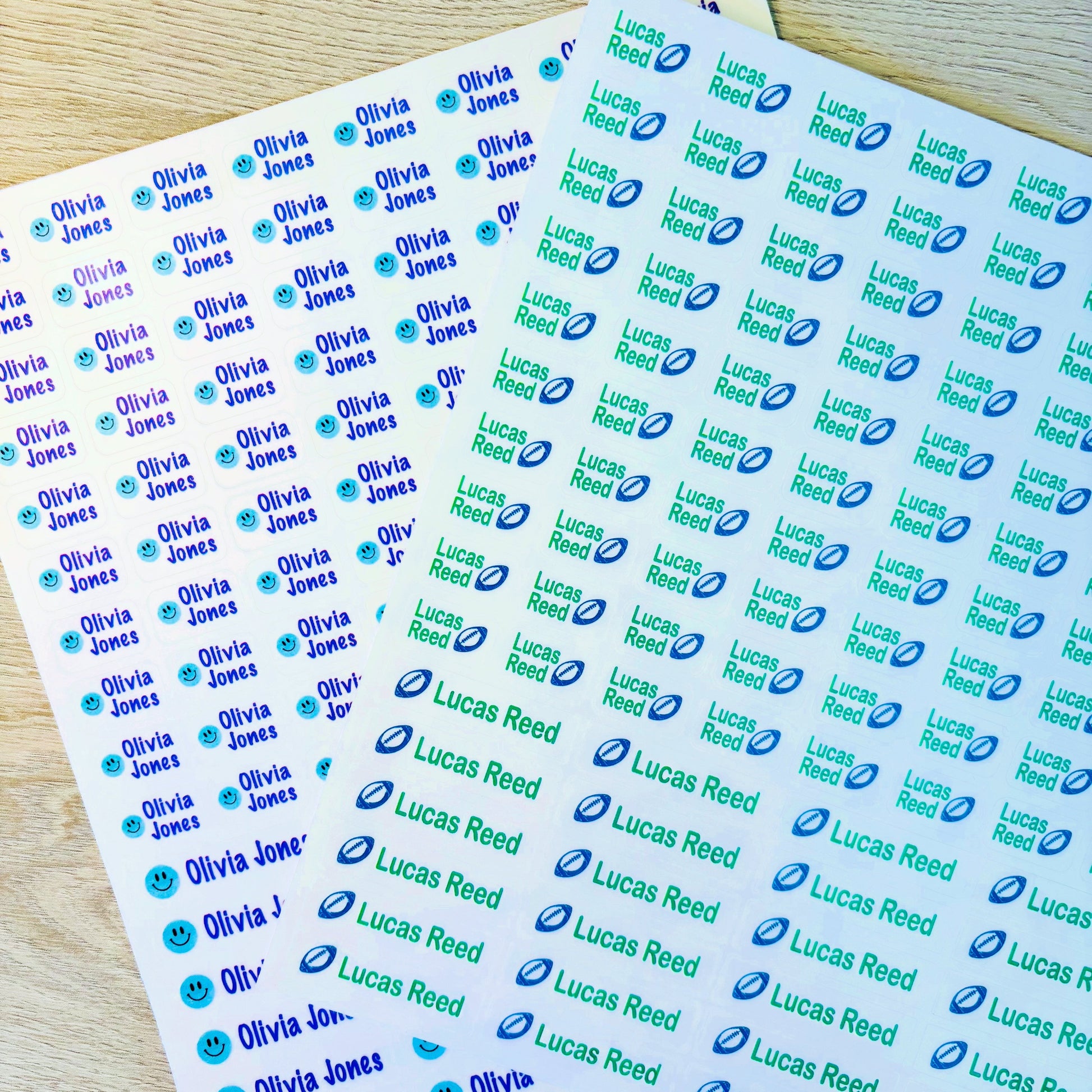Two sheets of personalized name stickers with various names printed on them.